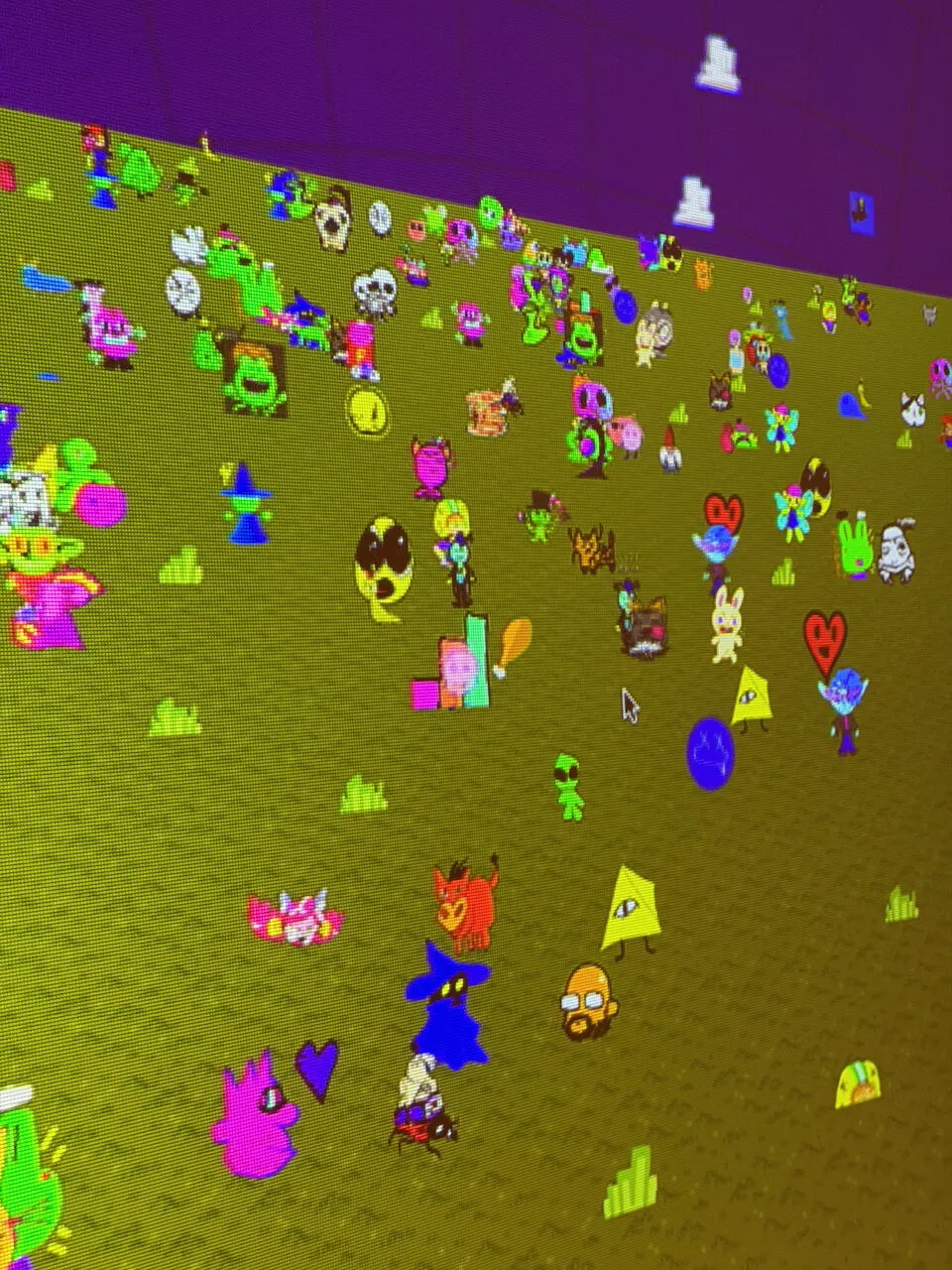A cluster of attendee-drawn creatures wandering the plaza